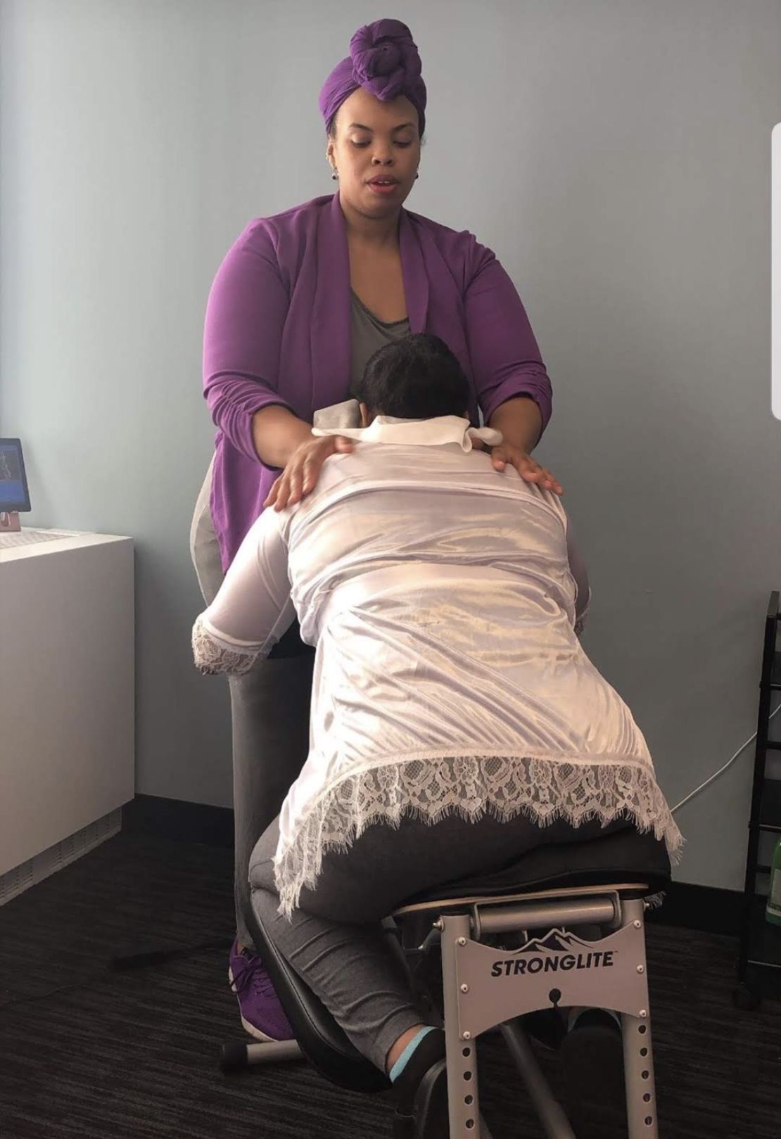 Nedra providing fully clothed chair massage at a corporate event
